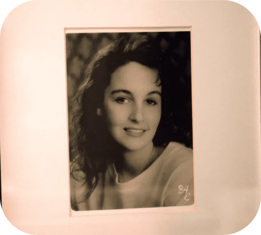 A framed photo in black and white of Jennifer from high school, before the accident.