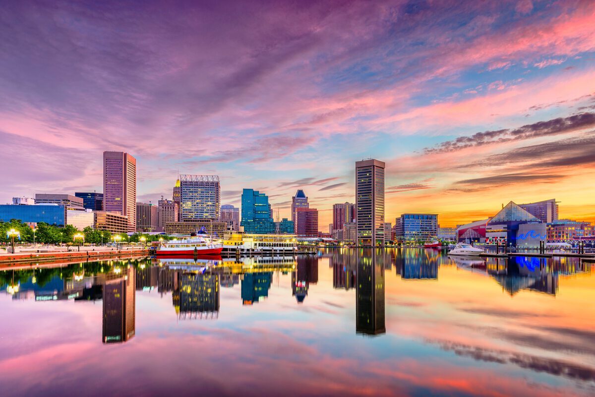 The Baltimore harbor skyline at sunset.